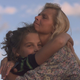 Jenna Stock and her mother Julie Stock share a hug while listening to music by Shawn Colvin at Lilith Fair in 1997.
